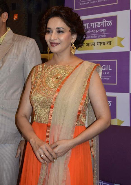 Madhuri Dixit in Orange Anarkali Suit At Gadgil Jewellers