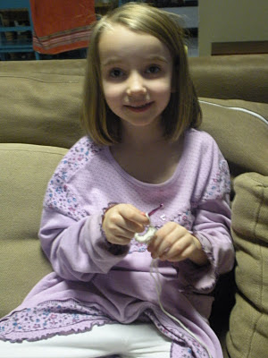 kid learning to crochet