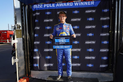 Derek Kraus, driver of the No. 19 NAPA AutoCare Chevrolet, poses for a photo after winning pole position.