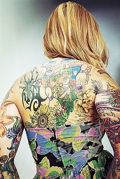 Tattooed woman´s back,beauty of a tattooed