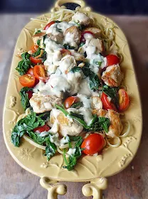 Chicken Florentine Pasta Recipe | by Life Tastes Good is chicken, spinach, tomatoes on a bed of linguine topped with a deliciously cheesy Mornay sauce! #Italian #Pasta #Sauce