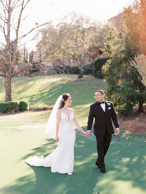 bride and groom walking and holding hands