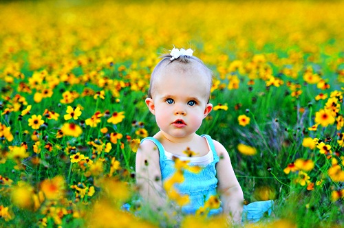 Baby Girl with Flowers