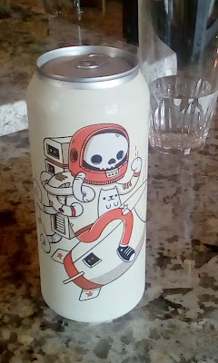 beer can with astronaut and cat artwork