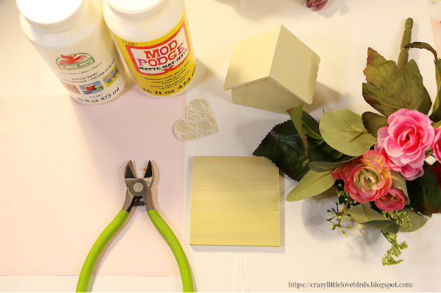 Craft materials such as, paint, mod podge, floral cutters and faux floral