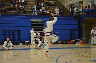 Martial arts black belt practicing to develop anger management