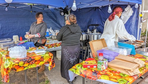 Women working at the corner stand