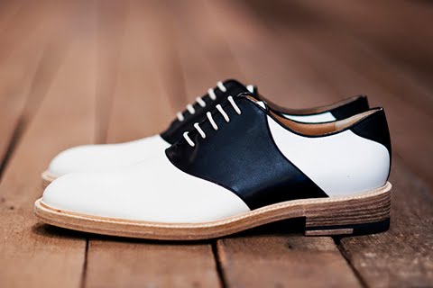 The classic saddle shoe combo of black and white done the Band way