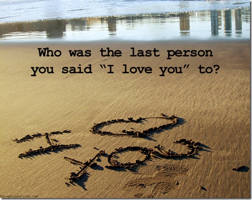 "I love you" written on a beach