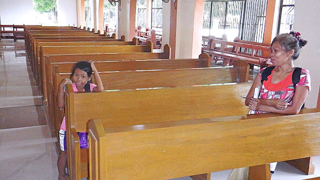 mother and child church cleaners at St. James the Greater Parish Church in Allen Northern Samar