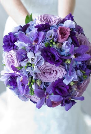 Gorgeous purple themed bridal bouquet with long stems