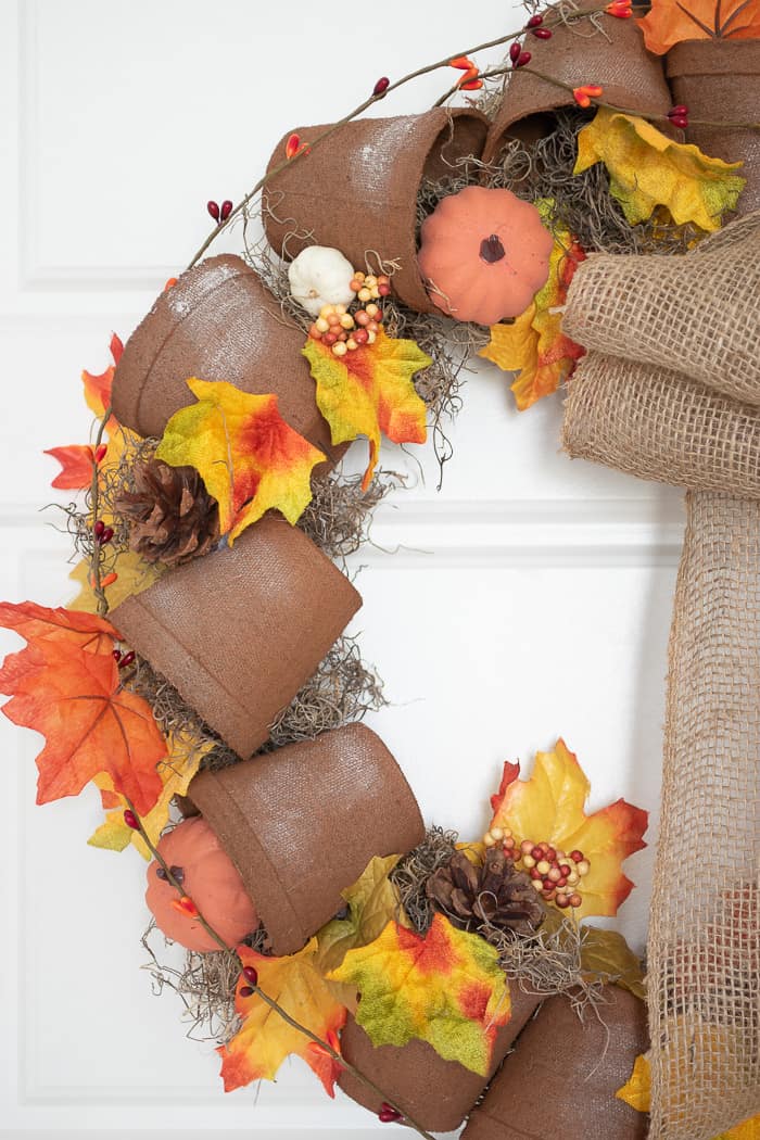 outdoor fall wreath with terracotta pots