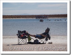 Guy sunbathing next to Laguna Cejar