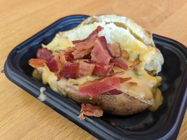 3/4 view of Wendy's Bacon Queso Baked Potato.