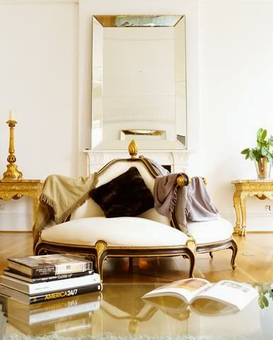 gilded gold circular settee in white foyer entry gold tables
