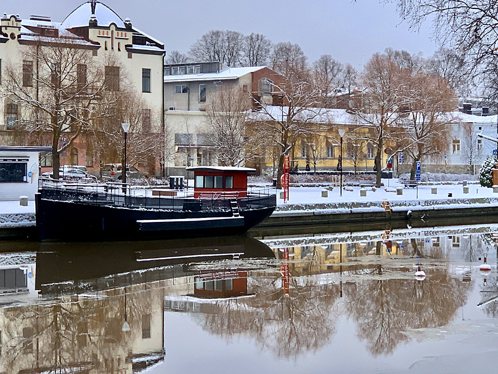 White Art Nouveau style building by the river
