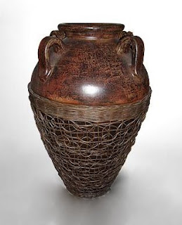 Antique flower vase with a decorative rattan.