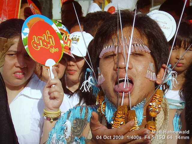 Thailand, Phuket, Vegetarian Festival, Tesagan Jia Chai, Nine Emperor Gods Festival, Taoist celebration, Thai Chinese man, mah song, street portrait, self-mutilation, piercing, impaling, ritualised mutilation