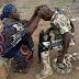 See  This Heartwarming Photo Of A Nigerian Mum Praying For Her Son, A Soldier… As He Goes To Fight Boko Haram In The Northeast