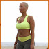 Amber Rose Shows Some Cleavage in a Neon Yellow Sports Bra