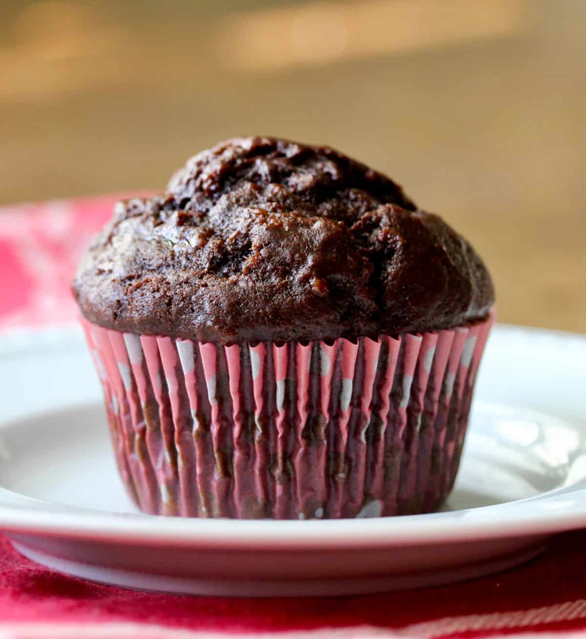 Double Chocolate Chip Banana Muffin in pink paper liner.