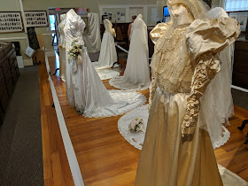 several of the bridal gowns on display