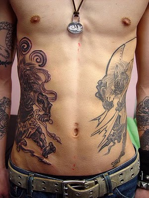 The large designs for rib cage tattoos are usually dark aggressive and bold