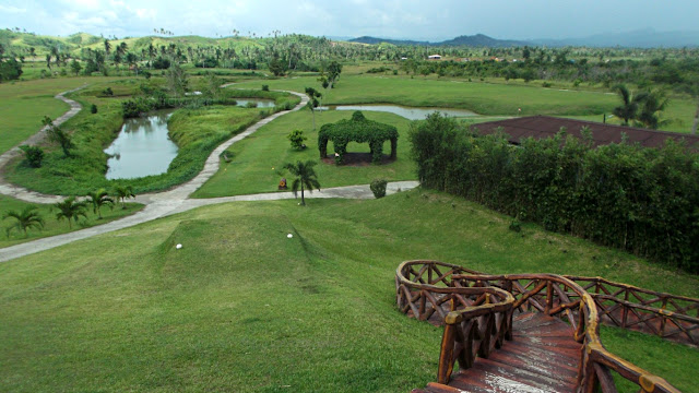view of tee-off area and the greens at san juanico park golf and country club