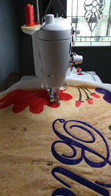 Floral frame applique quilt using Island Batik fabrics