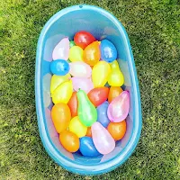 water balloons in a bathtub outside