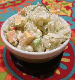 Bowl of potato like salad made from cauliflower