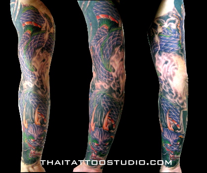 dragon sleeve tattoo. A full sleeve dragon tattoo