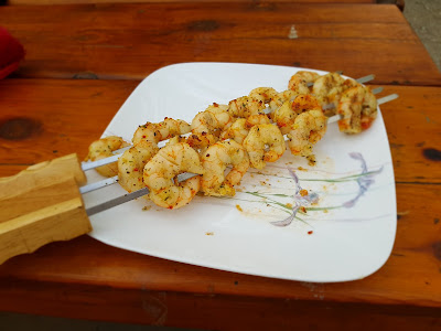 Cooked prawns on skewers