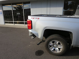 Collision damage on Chevy Silverado before repairs at Almost Everything Auto Body