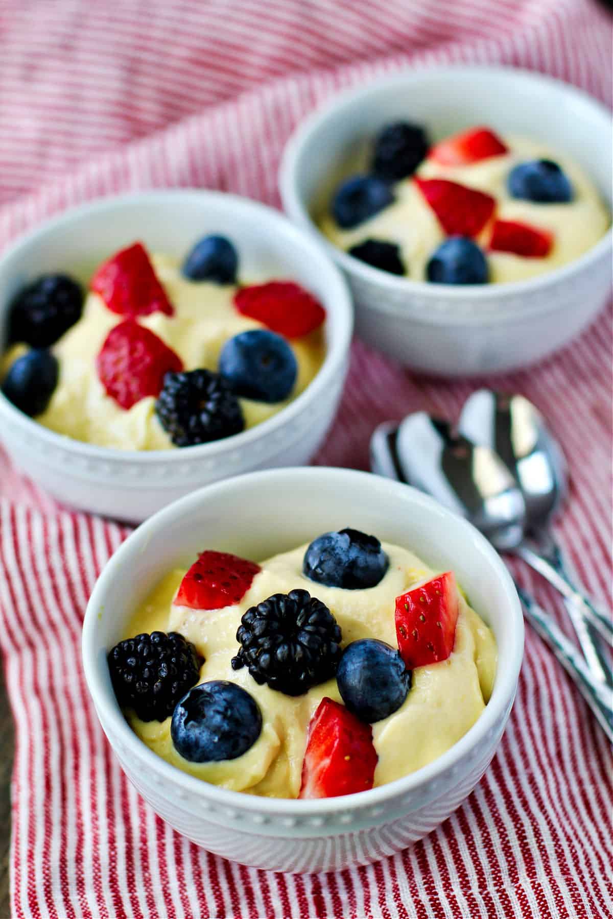 Mango Cream with Berries in a bowl.