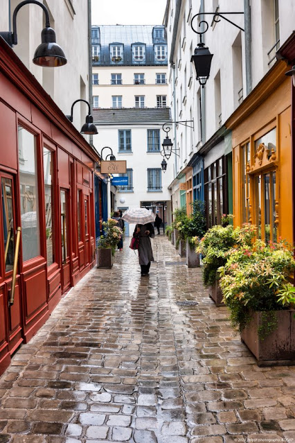 coloured shop fronts  on narrow lane