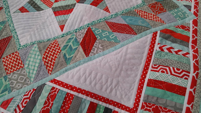 Red and aqua string star round robin quilt