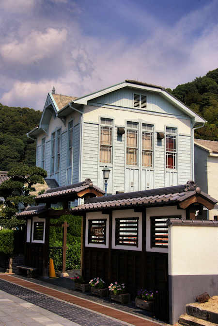 The museum is located in a two-storey, pale blue, western-style building in the middle of the historical district.