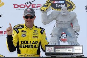 Matt Kenseth poses with the trophy in Victory Lane after winning the #NASCAR Sprint Cup Series AAA 400 Drive for Autism at Dover International Speedway