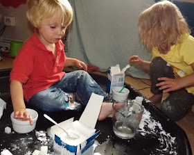 Messy construction play with sugar cubes and water icing