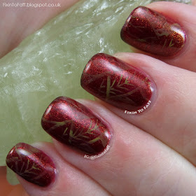 Fall or Autumn leaves nail art with marbled stamping over a glittery base.