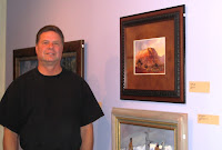 Artist Roland Lee standing in front of his painting selected for the 84th annual Spring Salon of the Springville Museum of Art in Springville Utah