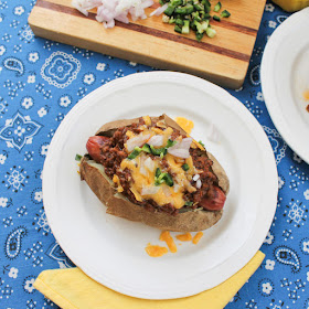 Food Lust People Love: Ban the bun and pass the potatoes! These chili cheese dog baked potatoes will be a favorite at your next family dinner or barbecue.
