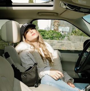 Elena Galera Moron posing for picture while sitting inside the car