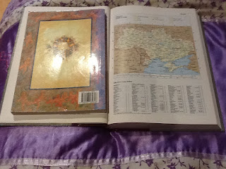 Some middle light on two books - one is a graphic book - the other is a map of Ukraine as it was in the 1990s.