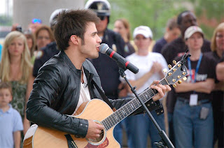 Kris Allen performing at the Riverfest Ampitheatre