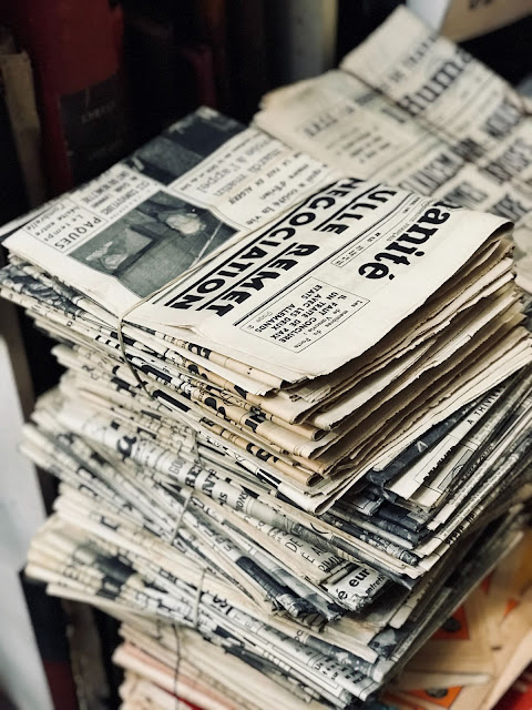 Bundle of Newspapers | Photo by Fabien Barral via Unsplash