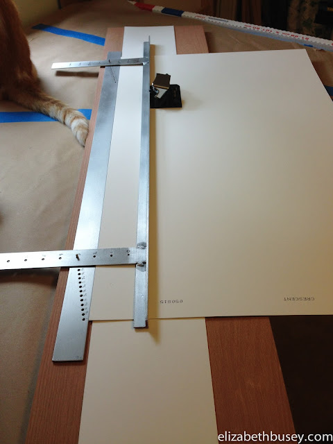 A measuring jig allows me to cut the mat window without expensive devices.