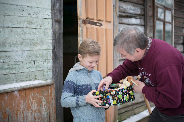 Boy in Belarus receiving his Operation Christmas Child shoebox