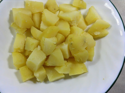 Boiled and sliced potatoes